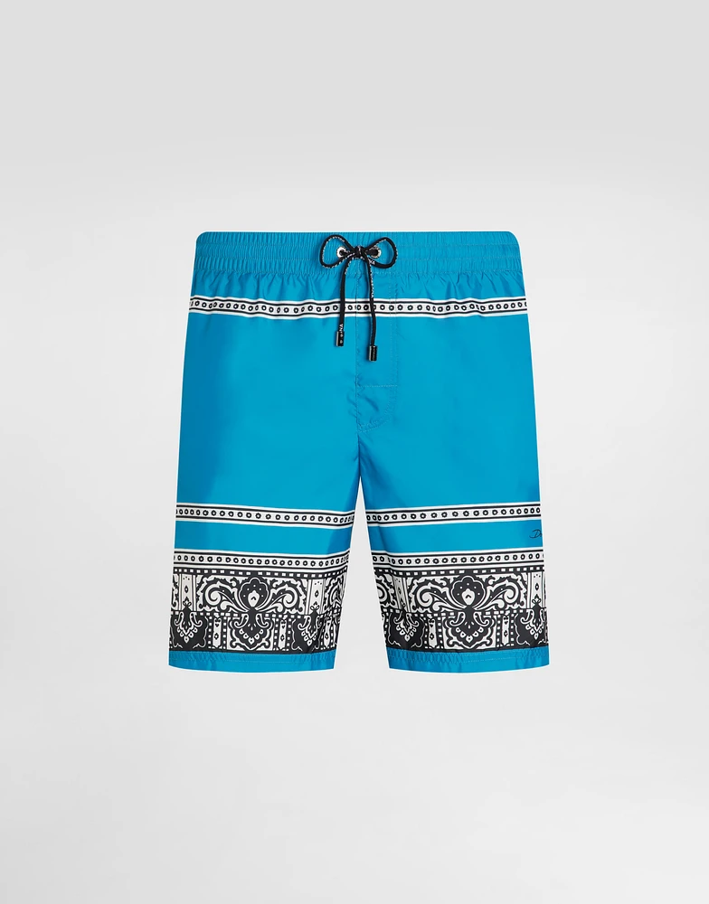 Mid-length swim trunks with bandanna print