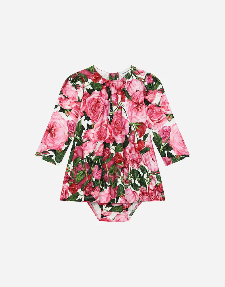 Interlock dress with rose print over a white background
