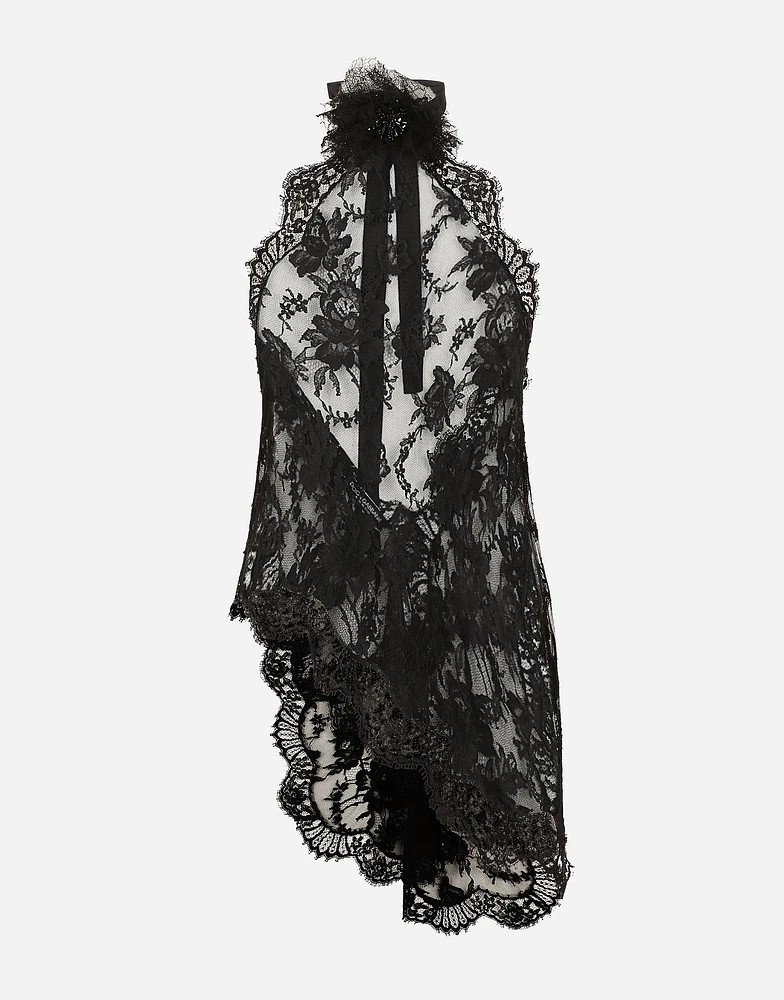 Asymmetrical lace top with flower detail on neck