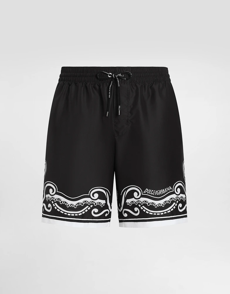 Mid-length swim trunks with bandanna print