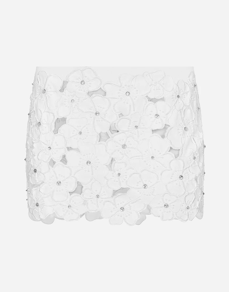 Cotton miniskirt with floral embroidery and rhinestone embellishment