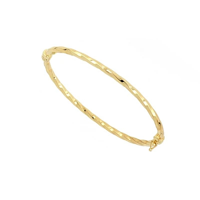Women's bangle bracelet, 10k gold twist, diamond cut. Color: yellow | Doucet Latendresse
