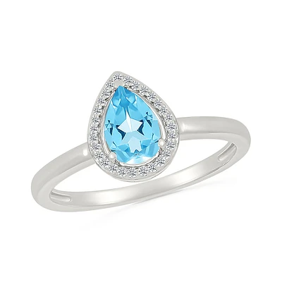 Sterling Silver Pear-Shaped Blue Topaz Ring with Diamond Halo. Color: white | Doucet Latendresse