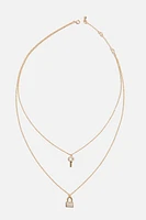 Collier à pavé avec pendentif de serrure et de clé