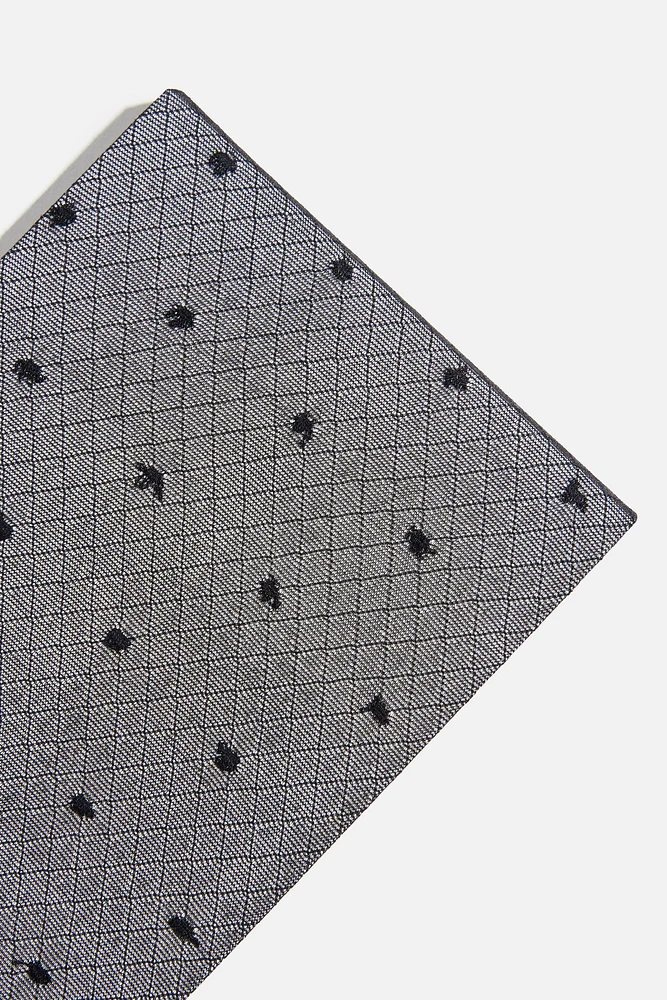 Collants résille diaphanes à pois