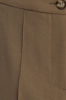 Pantalon surpiqué à jambe droite