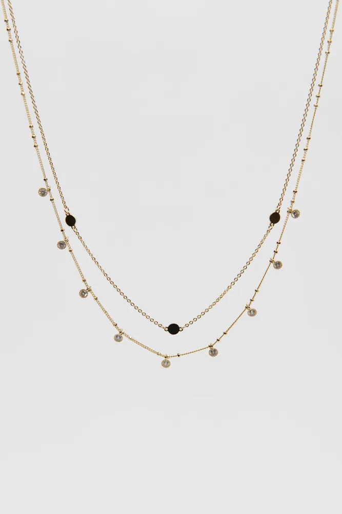 Collier superposé avec disques et pierres