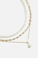 Collier superposé avec perles et chaînes