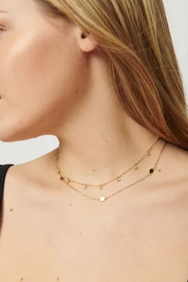 Collier superposé avec disques et pierres