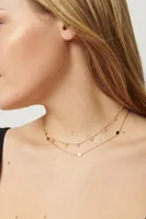 Collier superposé avec disques et pierres