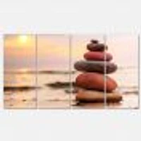 Panneaux de toile « Stones Pyramid on Sand Symbolizing Zen »
