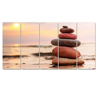 Panneaux de toile « Stones Pyramid on Sand Symbolizing Zen »