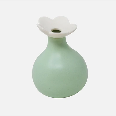 Green Vase With a White Flower Top