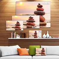 Toile « Stones Pyramid on Sand Symbolizing Zen »