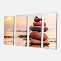 Panneaux de toile « Stones Pyramid on Sand Symbolizing Zen »