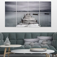 Pier and Boats at Seashore Canvas Wall Art