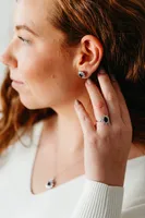 Oval Halo Ring with Blue Sapphire and .18 Carat TW of Diamonds in 10kt White Gold