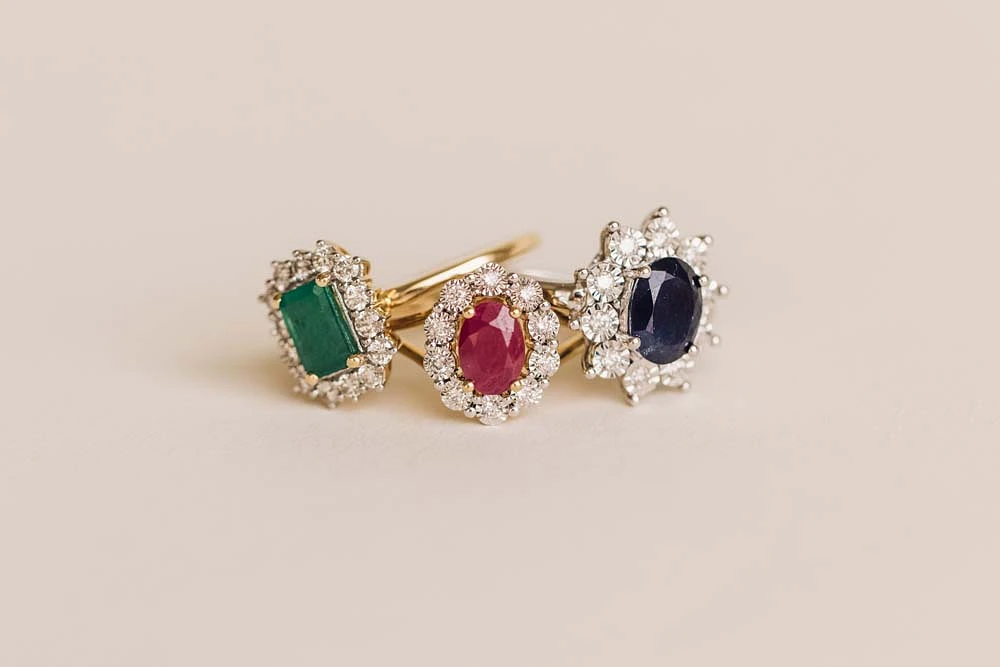 Oval Halo Ring with Ruby and .12 Carat TW of Diamonds in 10kt Yellow Gold