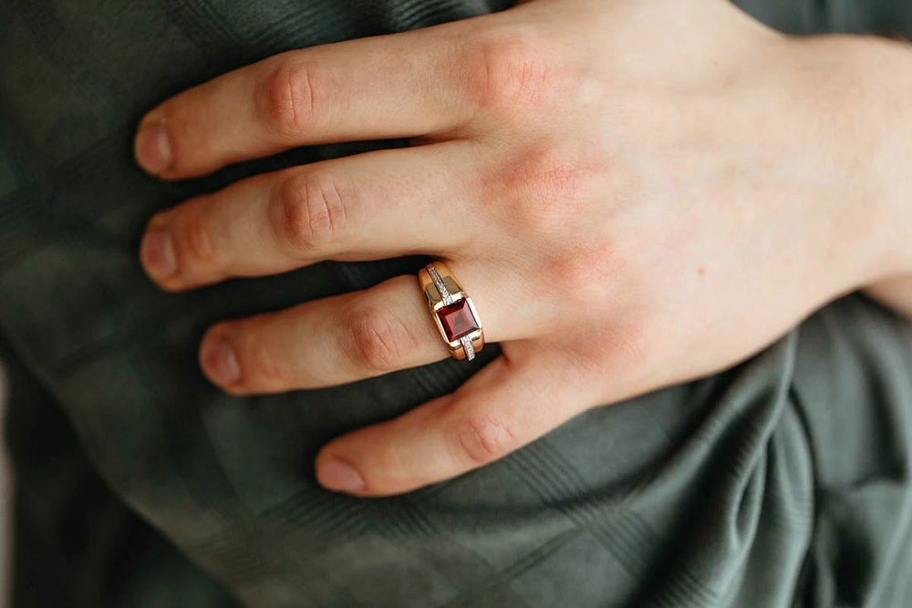 Ring with Garnet and .10 Carat TW of Diamonds in 10kt White and Yellow Gold