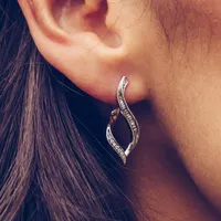 Twisted Hoop Earrings with .20 Carat TW of Diamonds in 10kt White Gold
