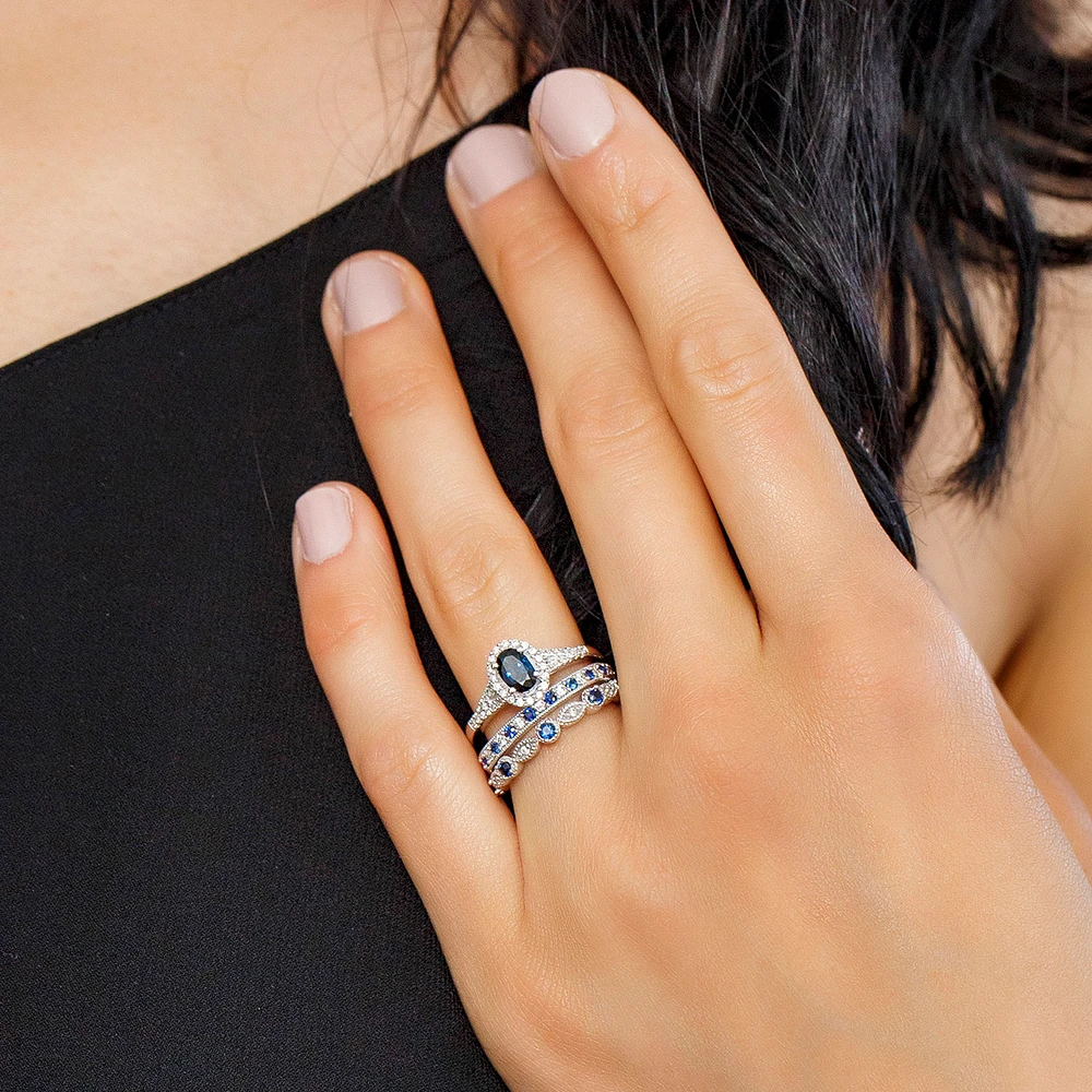 Ring with Blue Sapphire and .20 Carat TW of Diamonds in 10kt White Gold