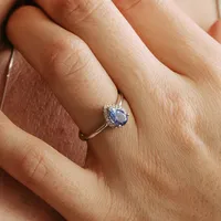 Ring with Tanzanite and .09 Carat TW of Diamonds in 10kt White Gold