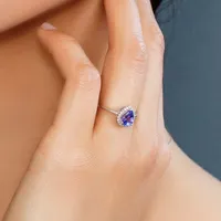 Ring with Tanzanite and .09 Carat TW of Diamonds in 10kt White Gold