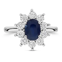 Oval Halo Ring with Blue Sapphire and .18 Carat TW of Diamonds in 10kt White Gold