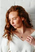 Oval Halo Ring with Blue Sapphire and .18 Carat TW of Diamonds in 10kt White Gold