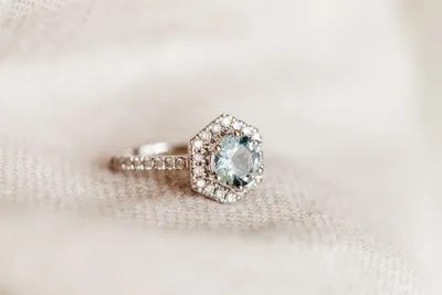 Ring with 7MM Round Aquamarine and .45 Carat TW of Diamonds in 14kt White Gold