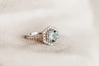 Ring with 7MM Round Aquamarine and .45 Carat TW of Diamonds in 14kt White Gold