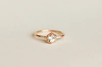 Ring with 5MM Aquamarine and .03 Carat TW of Diamonds in 10kt Rose Gold