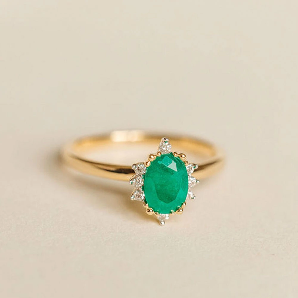 Ring with 7X5MM Emerald and .08 Carat TW of Diamonds in 14kt Yellow Gold
