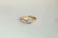 Ring with Oval 7X5MM Aquamarine and .20 Carat TW of Diamonds in 14kt Yellow Gold