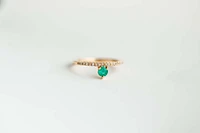 Ring with 3.8MM Round Emerald and .12 Carat TW of Diamonds in 14kt Yellow Gold