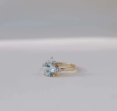 Ring with 7MM Round Aquamarine and .25 Carat TW of Diamonds in 14kt Yellow Gold