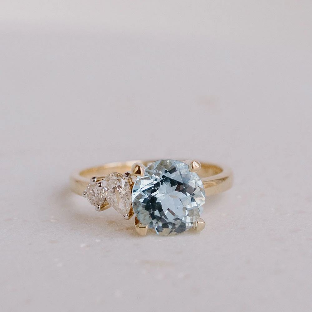 Ring with 8MM Round Aquamarine and .15 Carat TW of Diamonds in 14kt Yellow Gold