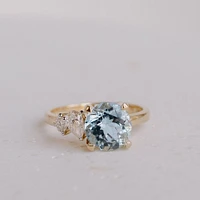 Ring with 8MM Round Aquamarine and .15 Carat TW of Diamonds in 14kt Yellow Gold