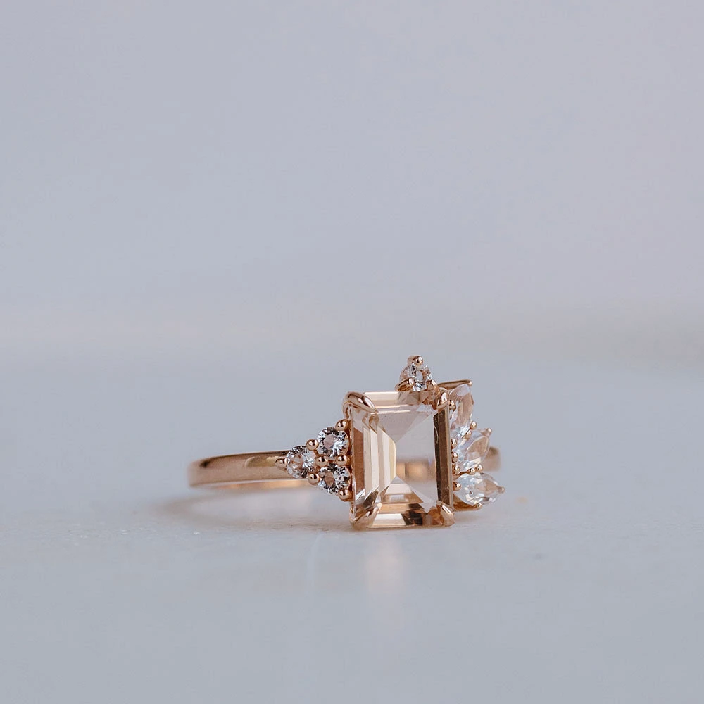 Ring with 8X6MM Emerald Cut Morganite and Round and Marquise White Topaz in 14kt Rose Gold
