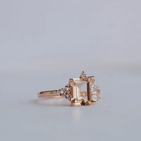 Ring with 8X6MM Emerald Cut Morganite and Round and Marquise White Topaz in 14kt Rose Gold