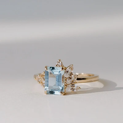 Ring with 8X6MM Emerald Cut Aquamarine and Round and Marquise White Topaz in 14kt Yellow Gold
