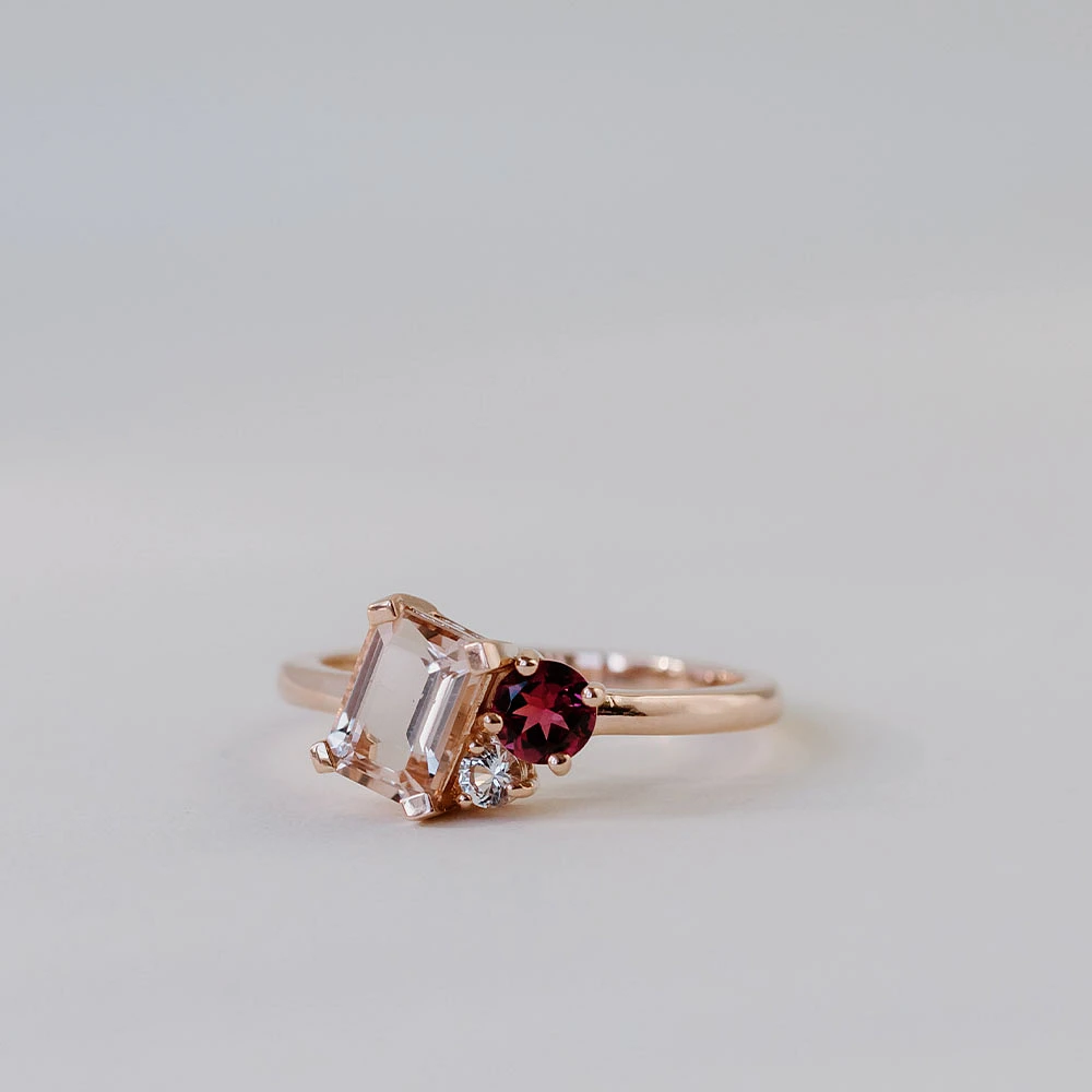 Ring with 7X5MM Emerald Cut Morganite, Pink Tourmaline and White Topaz in 10kt Rose Gold