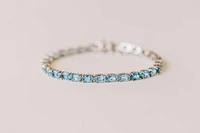 7.5″ Tennis Bracelet with Blue Topaz in Sterling Silver