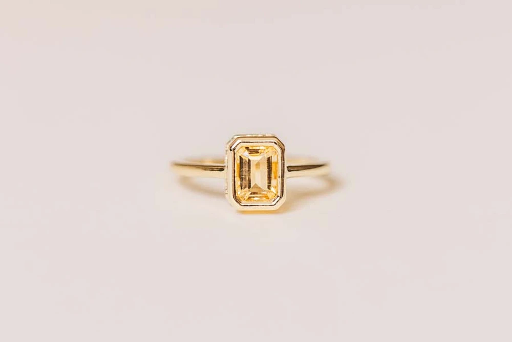 Ring with 7x5MM Emerald Cut Citrine in 10kt Yellow Gold