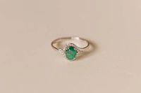 Halo Ring with .10 Carat TW of Diamonds and 7x5MM Oval Emerald in 10kt White Gold