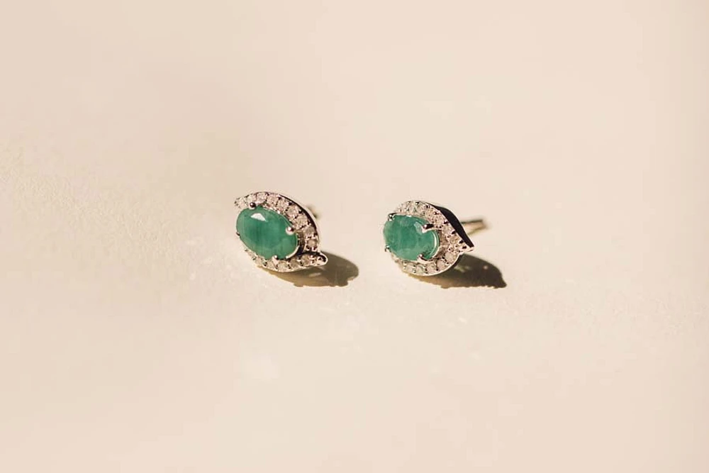 Halo Earrings with .17 Carat TW of Diamonds and 6x4MM Oval Emerald in 10kt White Gold