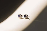 Halo Earrings with .17 Carat TW of Diamonds and 6x4MM Oval Blue Sapphire in 10kt White Gold