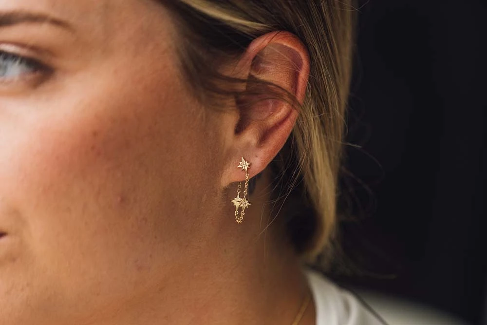 Dangling Star Chain Earrings with .03 Carat TW of Diamonds in 10kt Yellow Gold