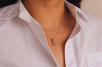 Infinity Pendant with .10 Carat TW of Diamonds in 10kt Yellow Gold with Chain