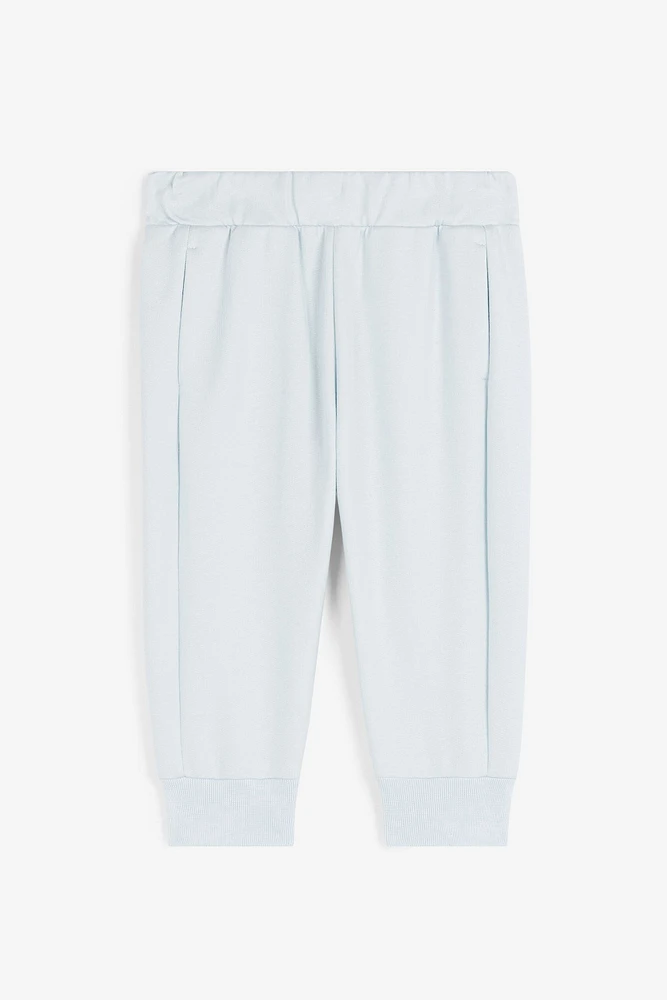 RC Monogram-Print Cotton Track Pants